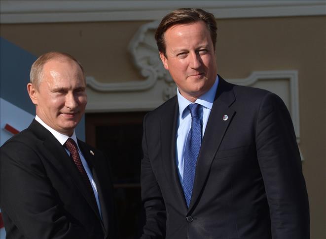Cameron, Putin meet in France before D-Day celebrations