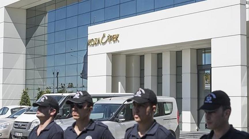 Turkish police search premises of two holdings