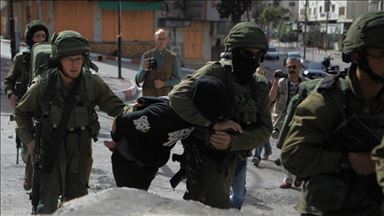 Israel arrests 14 Palestinians in West Bank raids