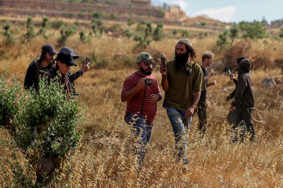 Israeli settlers attack Palestinians, foreign activists in West Bank
