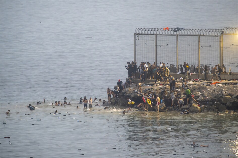 Migrants arrive on shore after attempting sea crossing to Ceuta from Morocco