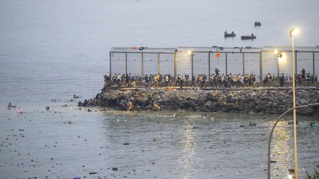 Migrants arrive on shore after attempting sea crossing to Ceuta from Morocco